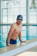 Swimmers practicing in a large swimming pool