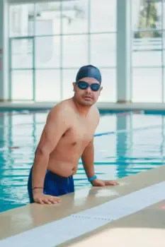 Swimmers practicing in a large swimming pool
