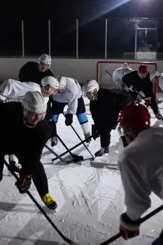 Ice hockey players competing on an ice rink